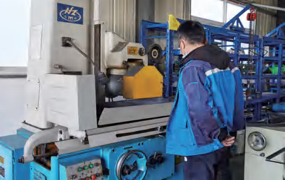 Factory & Production Operator beside production equipment