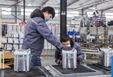 Factory & Production Workers assembling washing machine components